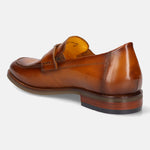 Brown leather penny loafer by bugatti, seen from the back at a slight angle, with a stacked heel.