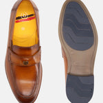 Tan leather loafer by bugatti, featuring a yellow inner lining and grooved blue sole.
