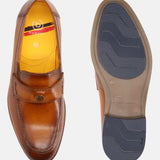 Tan leather loafer by bugatti, featuring a yellow inner lining and grooved blue sole.