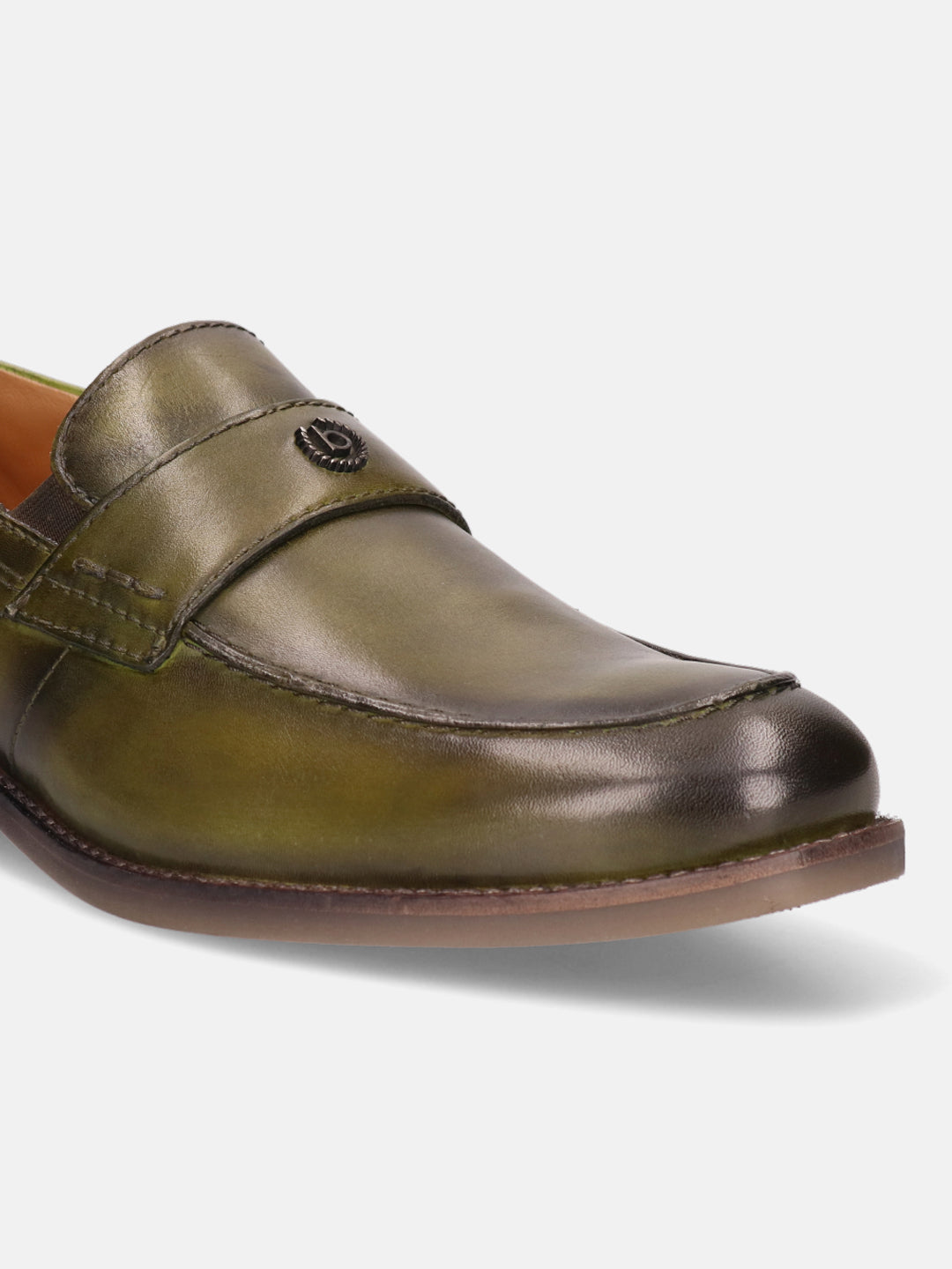 Green leather penny loafer by bugatti with a decorative metal logo on the upper strap.