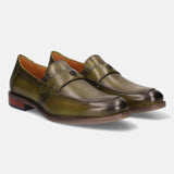 Green leather penny loafers by bugatti, showing top stitching, logo detail on the strap, and a wood-look heel.
