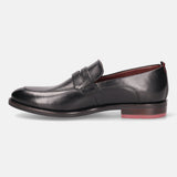 A black Men's bugatti Penny Loafer featuring a round apron toe, moulded  heel. Made from premium genuine leather with a durable tr outsole, this slip-on design offers both style and comfort.