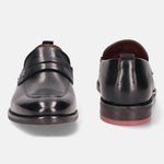 A black Men's bugatti Penny Loafer featuring a round apron toe, moulded  heel. Made from premium genuine leather with a durable tr outsole, this slip-on design offers both style and comfort.