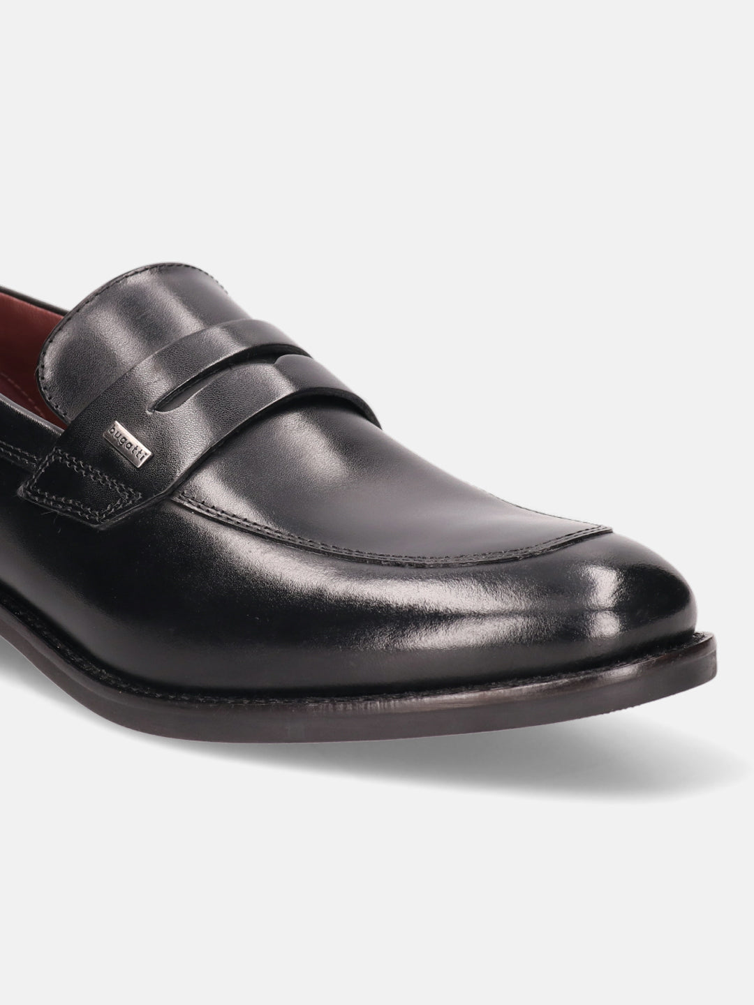 A black Men's bugatti Penny Loafer featuring a round apron toe, moulded  heel. Made from premium genuine leather with a durable tr outsole, this slip-on design offers both style and comfort.