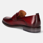 A grey Men's bugatti Penny Loafer featuring a round apron toe, moulded  heel. Made from premium genuine leather with a durable tr outsole, this slip-on design offers both style and comfort.