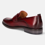 A grey Men's bugatti Penny Loafer featuring a round apron toe, moulded  heel. Made from premium genuine leather with a durable tr outsole, this slip-on design offers both style and comfort.