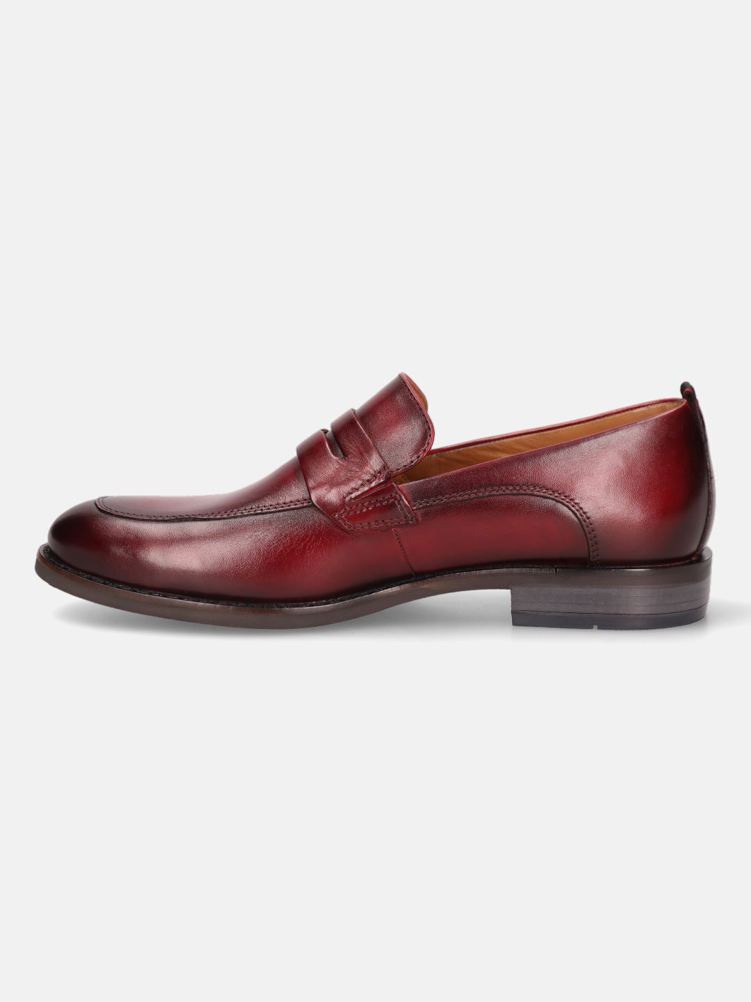 Red leather penny loafer by bugatti with a classic design and a low heel.