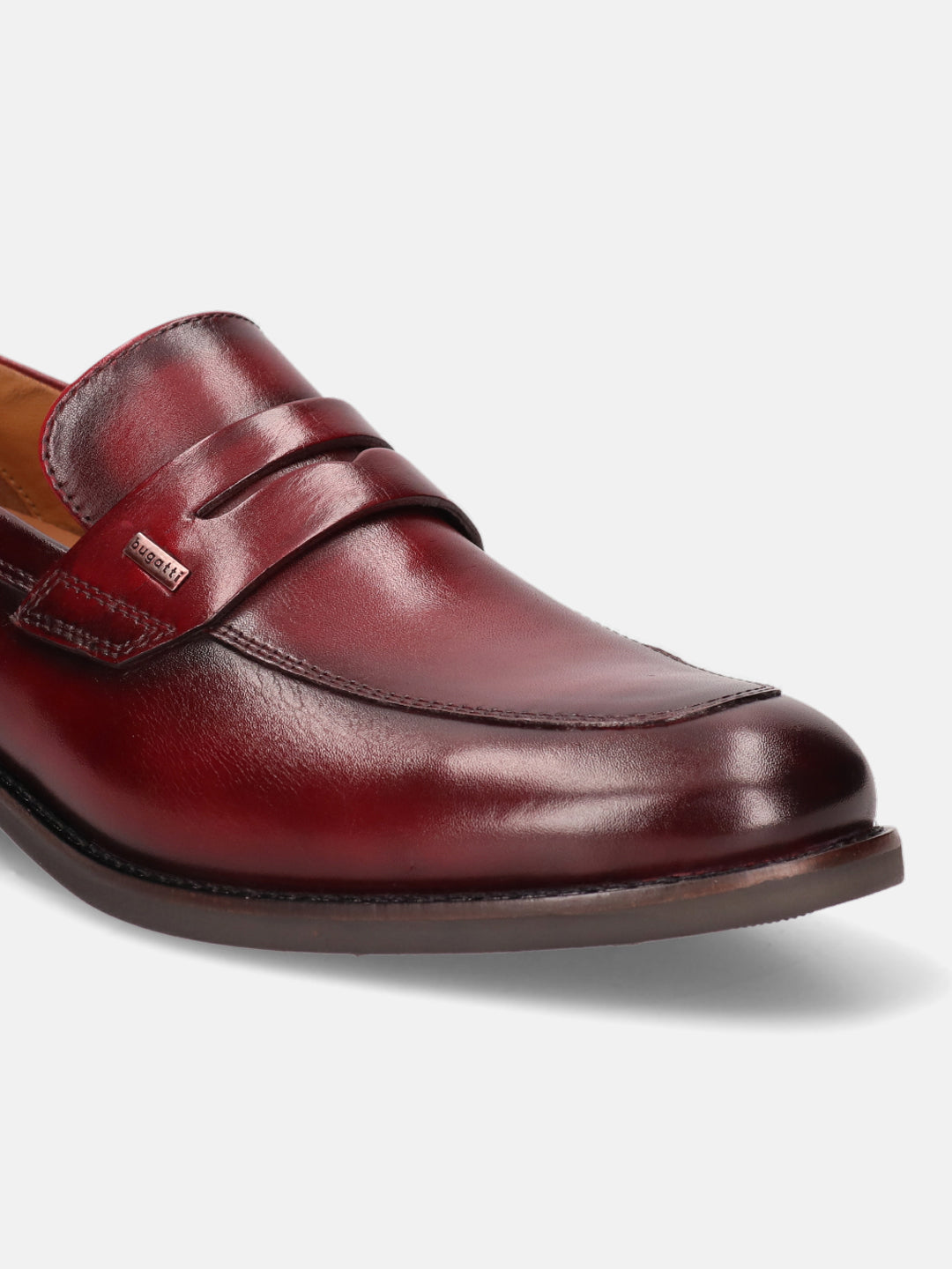 A grey Men's bugatti Penny Loafer featuring a round apron toe, moulded  heel. Made from premium genuine leather with a durable tr outsole, this slip-on design offers both style and comfort.