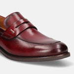 A grey Men's bugatti Penny Loafer featuring a round apron toe, moulded  heel. Made from premium genuine leather with a durable tr outsole, this slip-on design offers both style and comfort.
