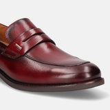 A grey Men's bugatti Penny Loafer featuring a round apron toe, moulded  heel. Made from premium genuine leather with a durable tr outsole, this slip-on design offers both style and comfort.