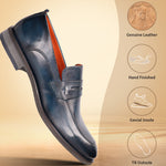 Blue leather penny loafers by bugatti with a shiny finish, shown floating on a beige background.