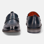 Blue leather penny loafers by bugatti with tonal stitching and visible orange lining.