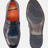 A blue Men's bugatti Penny Loafer featuring a round apron toe, moulded  heel. Made from premium genuine leather with a durable tr outsole, this slip-on design offers both style and comfort.
