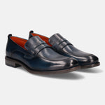 A blue Men's bugatti Penny Loafer featuring a round apron toe, moulded  heel. Made from premium genuine leather with a durable tr outsole, this slip-on design offers both style and comfort.