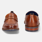 A cognac Men's bugatti Penny Loafer featuring a round apron toe, moulded  heel. Made from premium genuine leather with a durable tr outsole, this slip-on design offers both style and comfort.