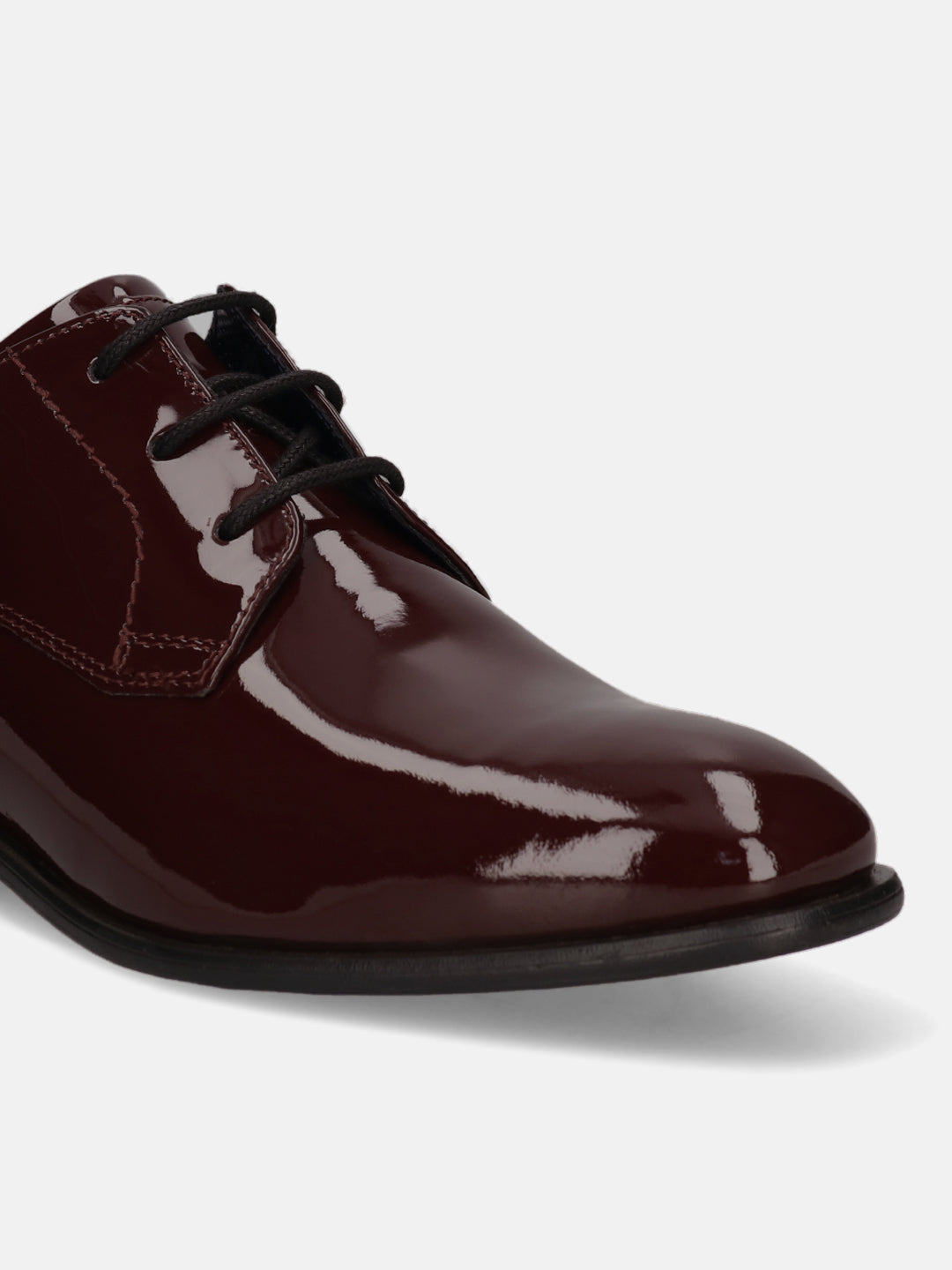 Burgundy formal derby shoe by bugatti with a glossy patent finish and black laces.