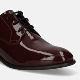 Burgundy formal derby shoe by bugatti with a glossy patent finish and black laces.