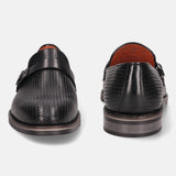 Black leather penny loafers by bugatti with decorative textured pattern and strap.