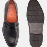 Black leather penny loafer by bugatti, with perforated upper and patterned rubber sole.