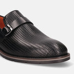 Black leather penny loafer by bugatti, featuring a woven texture and buckle detail.