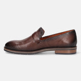 Brown leather penny loafer by bugatti, featuring a subtle textured pattern.
