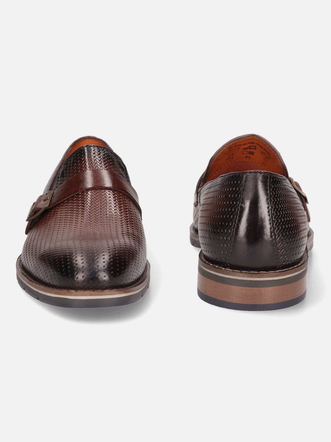 Brown leather penny loafers by bugatti with a textured, perforated pattern and a tonal strap.