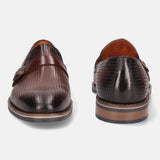 Brown leather penny loafers by bugatti with a textured, perforated pattern and a tonal strap.