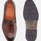 Brown leather penny loafers by bugatti, with perforated texture, decorated with a dark brown strap and buckle.