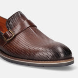 Brown premium leather penny loafer by bugatti, with perforated pattern and buckle detail.