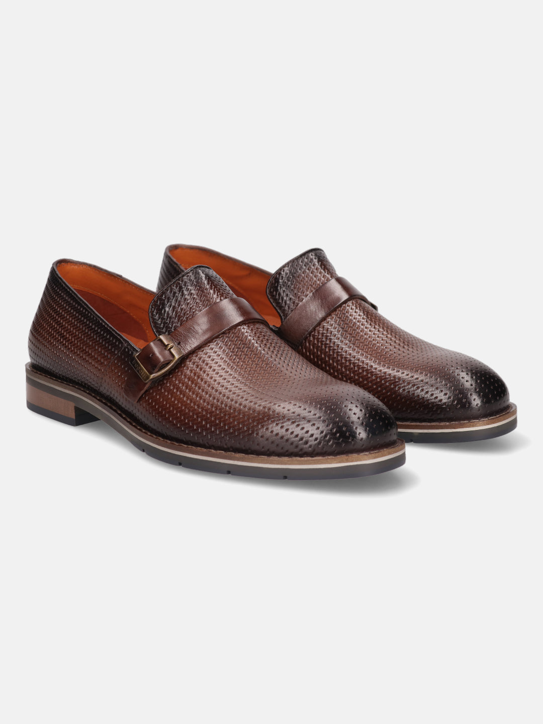 Brown premium leather penny loafers by bugatti, featuring a textured and perforated upper and subtle buckled strap.
