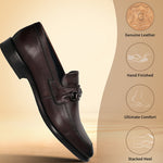 Brown leather slip-on shoe by Bugatti with a metal accent piece and stacked heel.