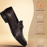 Brown leather slip-on shoe by Bugatti with a metal accent piece and stacked heel.