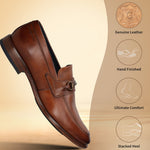 A cognac Men's bugatti Bit Loafer featuring a round toe apron toe, stacked heel. Made from premium genuine leather with a durable leather outsole, this slip-on design offers both style and comfort.