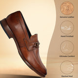 A cognac Men's bugatti Bit Loafer featuring a round toe apron toe, stacked heel. Made from premium genuine leather with a durable leather outsole, this slip-on design offers both style and comfort.