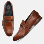 A cognac Men's bugatti Bit Loafer featuring a round toe apron toe, stacked heel. Made from premium genuine leather with a durable leather outsole, this slip-on design offers both style and comfort.