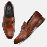 A cognac Men's bugatti Bit Loafer featuring a round toe apron toe, stacked heel. Made from premium genuine leather with a durable leather outsole, this slip-on design offers both style and comfort.