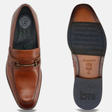A cognac Men's bugatti Bit Loafer featuring a round toe apron toe, stacked heel. Made from premium genuine leather with a durable leather outsole, this slip-on design offers both style and comfort.
