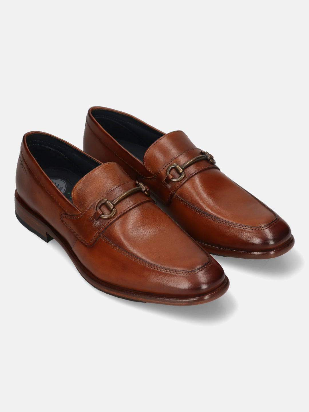 A cognac Men's bugatti Bit Loafer featuring a round toe apron toe, stacked heel. Made from premium genuine leather with a durable leather outsole, this slip-on design offers both style and comfort.