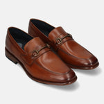 A cognac Men's bugatti Bit Loafer featuring a round toe apron toe, stacked heel. Made from premium genuine leather with a durable leather outsole, this slip-on design offers both style and comfort.