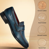 Dark blue leather slip-on shoe by bugatti, shown at an angle with a black stacked heel.