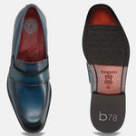 Dark blue leather slip-on shoe by bugatti, showing the top view and the sole of the shoe.