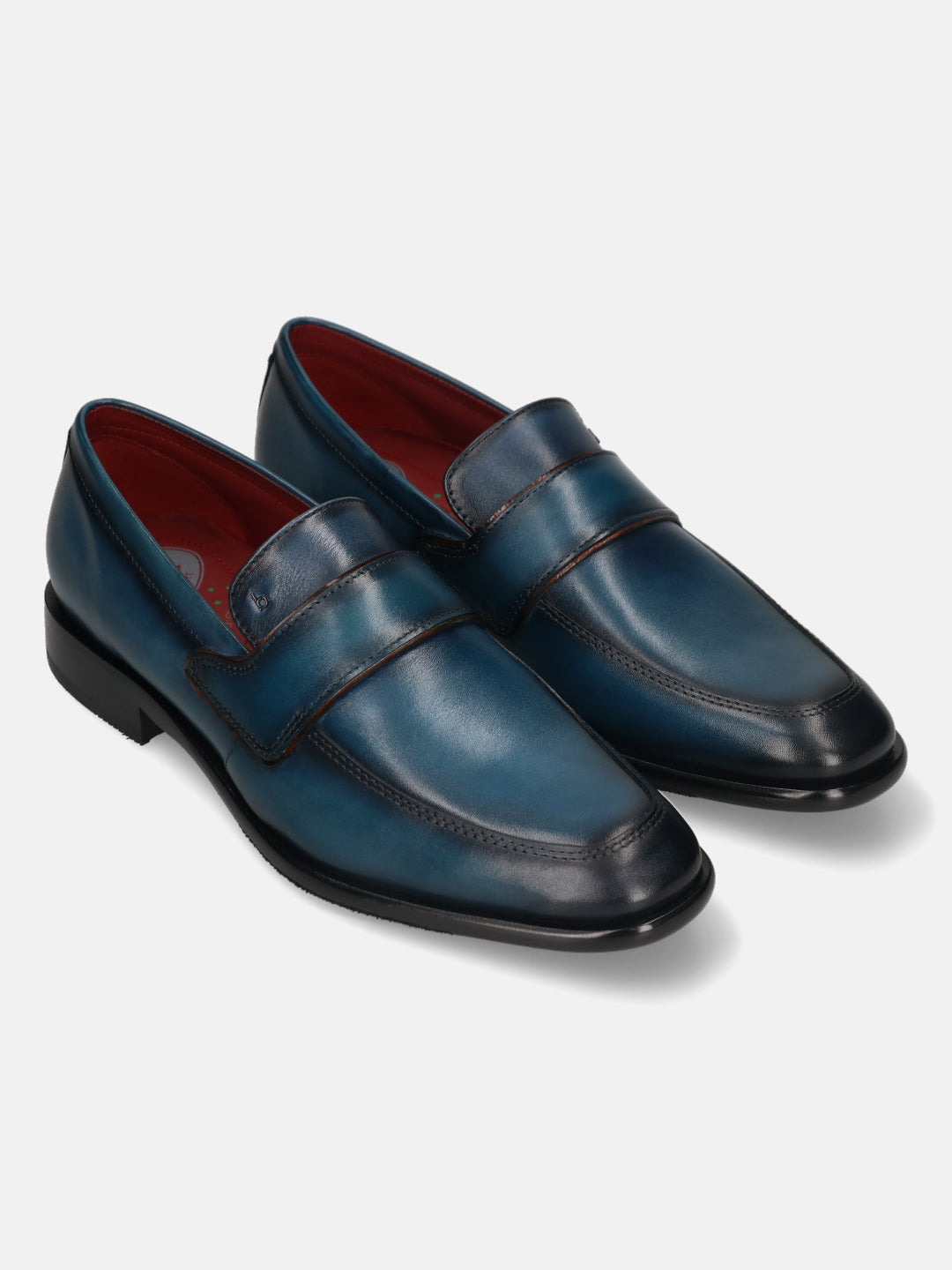 Blue leather slip-on formal shoes by bugatti, featuring a comfortable construction and dark accents.