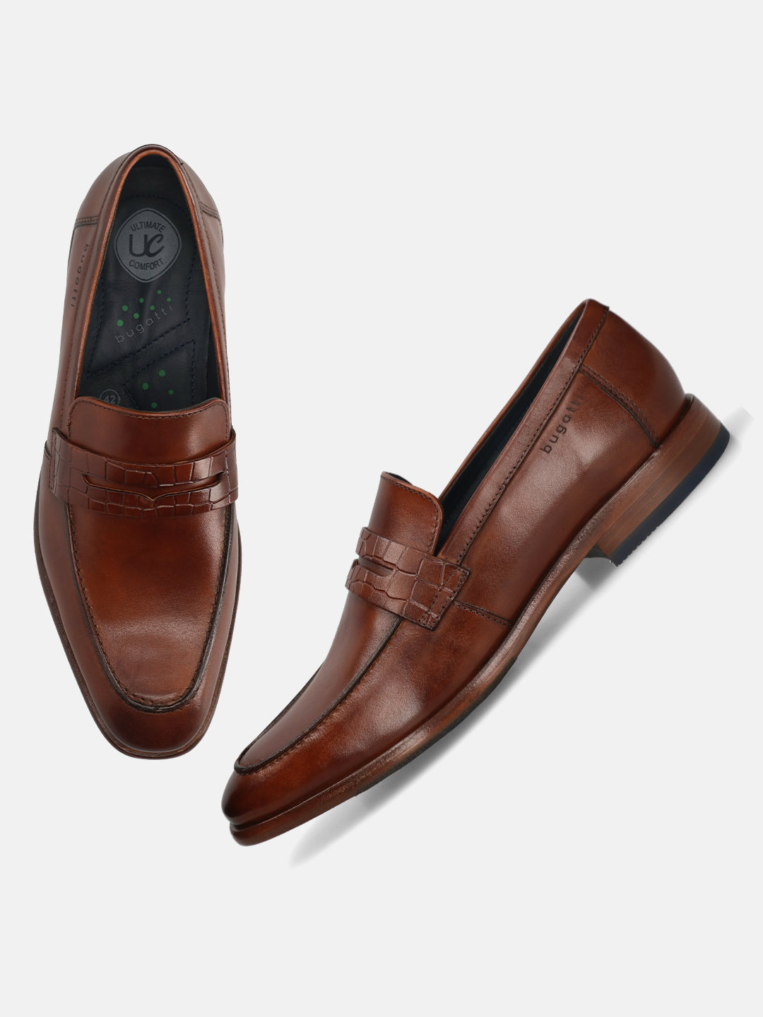Cognac leather penny loafers by bugatti, with a woven leather strap detail and comfort insole.