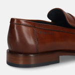 Cognac leather loafer by bugatti, featuring a smooth, polished finish, visible stitching, and a low heel.