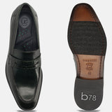 Dark green premium leather penny loafers by bugatti, showcasing croc-embossed details and the shoe's sole.