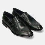 Dark green leather penny loafers by bugatti with basket weave saddle, dark soles, and subtle sheen.
