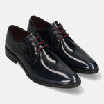 Dark blue leather derby shoes by bugatti with shiny finish and red shoelaces.