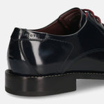 Dark blue leather formal derby shoes by bugatti, showing the heel and stitched details.