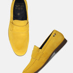 Yellow leather penny loafers by bugatti with a smooth, matte finish and dark brown soles.