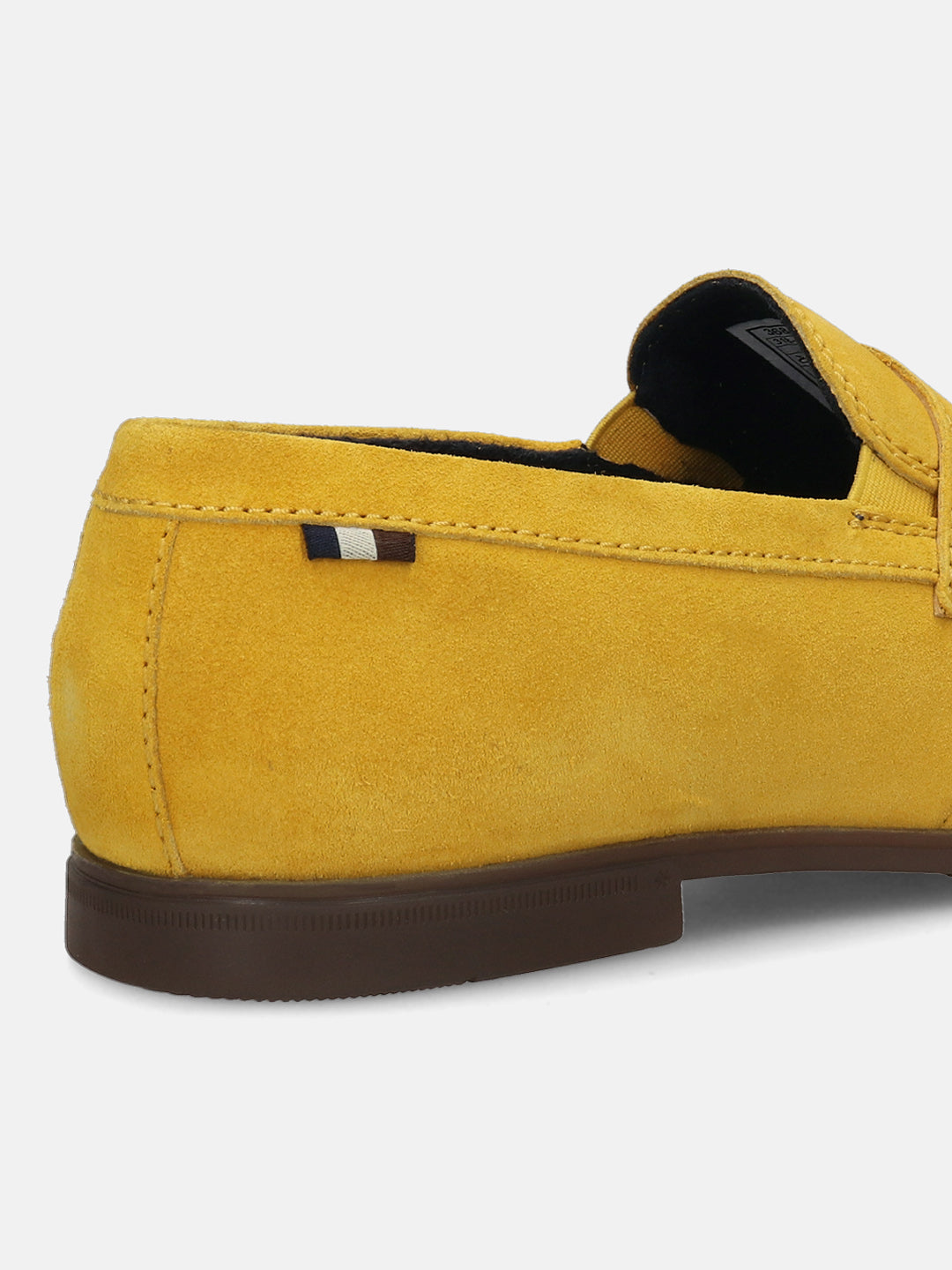 Yellow leather loafer by bugatti, featuring a penny loafer strap and tonal stitching.